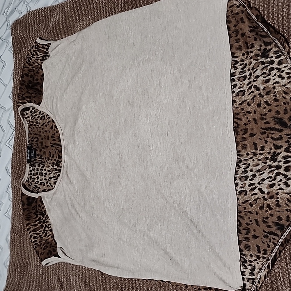 Sleeveless top. Animal print. Size Large. Brand is Phopsody.